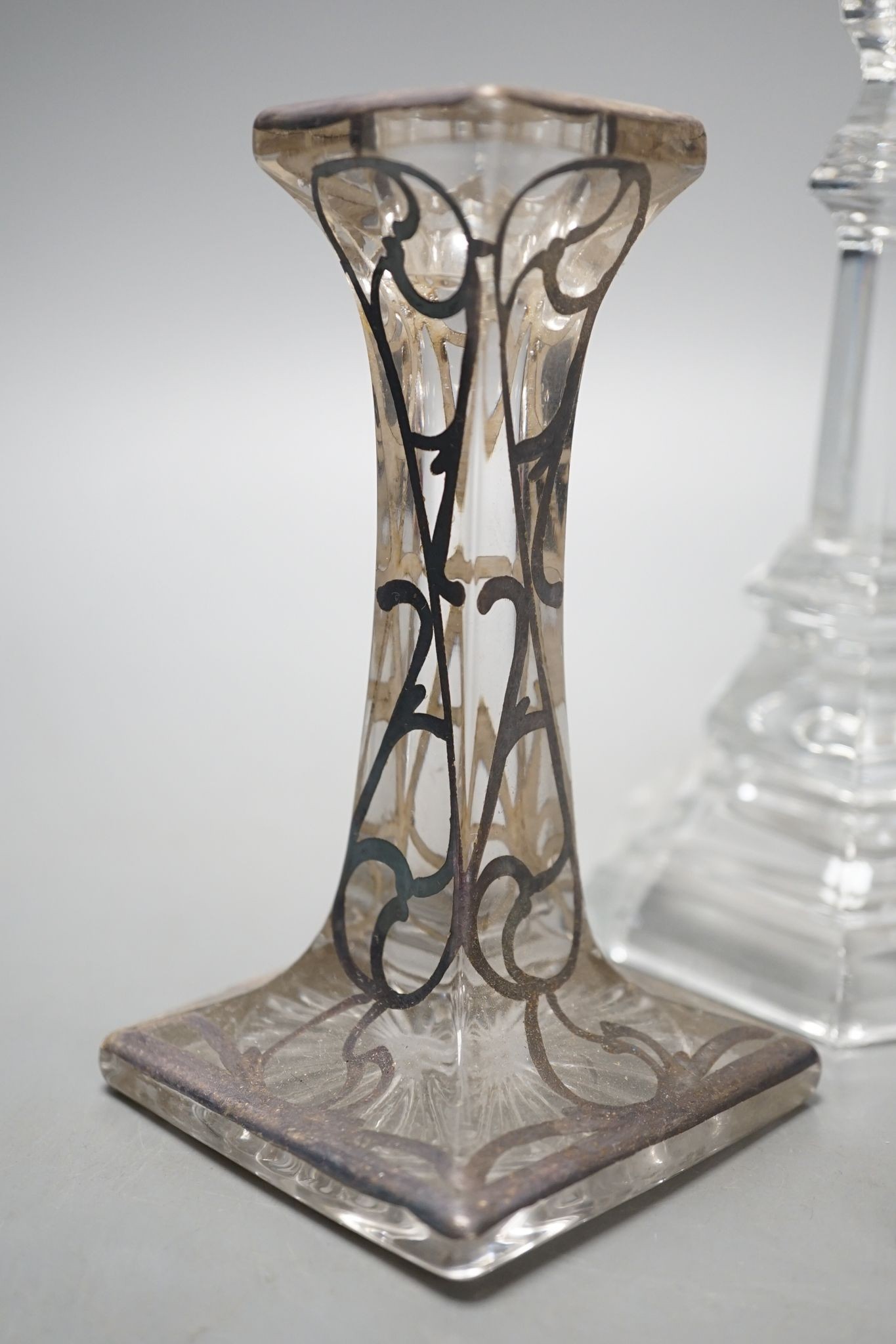 A pair of Tiffany & Co. glass candlesticks and a pair of silver overlaid glass candlesticks 20cm